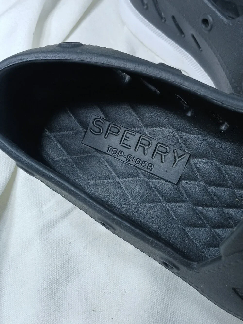 Sperry Black Perforated Slip-On Boat Shoes with White Sole